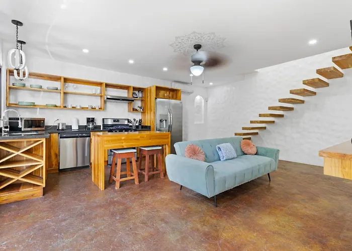 Modern With Chic Bohemian Style And Zen Outdoor Oasis With Swimming Pool And Tiki Style Dining Space