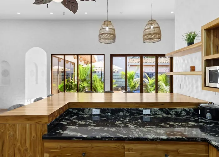 Modern With Chic Bohemian Style And Zen Outdoor Oasis With Swimming Pool And Tiki Style Dining Space *